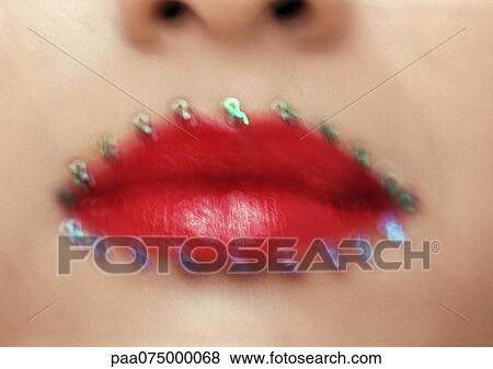 Woman wearing red lipstick, close up of mouth with jewel adornments, blurred. View Large Photo Image Stock Photo - Woman wearing red lipstick, close up of mouth with jewel adornments, blurred.. Fotosearch