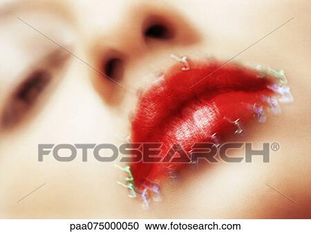Woman wearing red lipstick, looking at camera, close up of mouth with jewel adornment, low angle view blurred. View Large Photo Image Stock Image - Woman wearing red lipstick, looking at camera, close up of mouth with jewel adornment, low angle view blurred.. Fotosearch