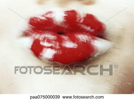 Stock Photo - Woman's lips painted white and red, close up, blurred.. Fotosearch