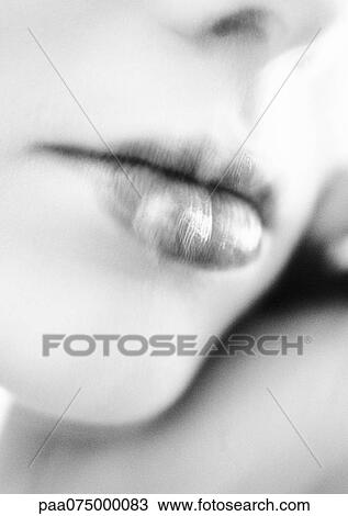 Stock Image - Woman's mouth, close up, black and white, blurred.. Fotosearch