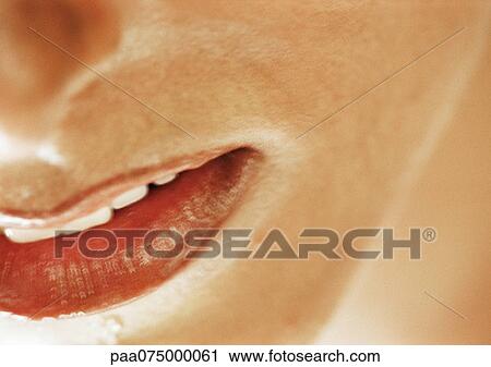 Stock Image - Woman's mouth, close up, high angle view. Fotosearch