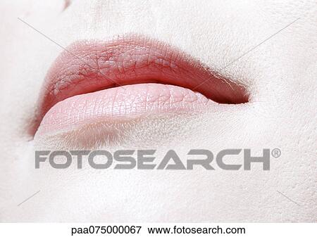 Stock Photo - Woman's pink mouth, close up, low angle view. Fotosearch