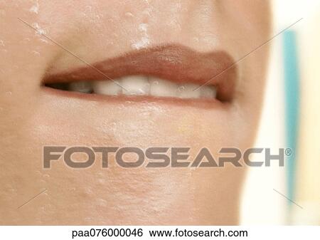 Close up of woman biting her bottom lip. View Large Photo Image Stock Photograph - Close up of woman biting her bottom lip.. Fotosearch