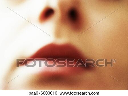 Stock Photograph - Close up of woman's face, partial view. Fotosearch