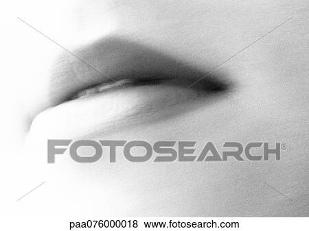 Stock Photo - Close up of woman's mouth, black and white, blurred. Fotosearch