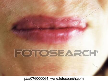 Picture - Close up of woman's mouth, blurred. Fotosearch