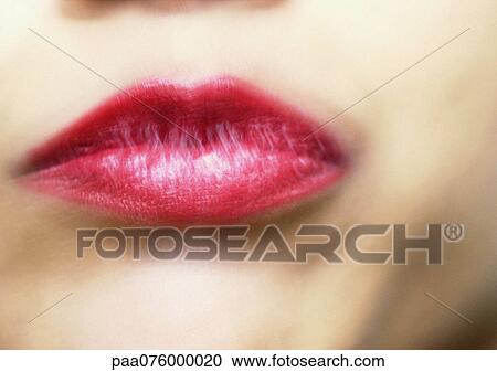 Stock Image - Close up of woman's mouth, blurry.. Fotosearch
