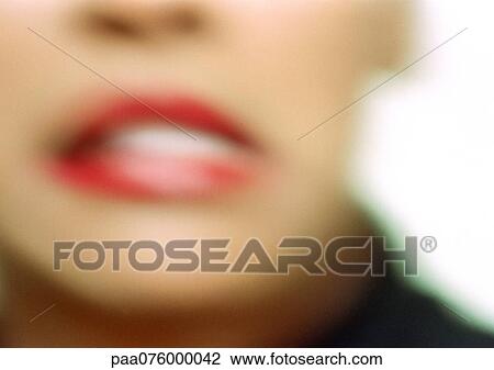 Stock Image - Close up of woman's mouth, blurry.. Fotosearch