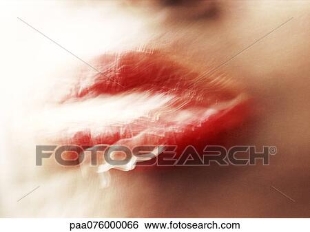 Stock Photograph - Close up of woman's mouth, blurry.. Fotosearch