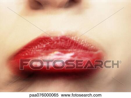 Stock Photography - Close up of woman's mouth frowning, blurry.. Fotosearch