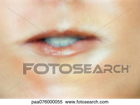 Stock Photography - Close up of woman's mouth making expression.. Fotosearch