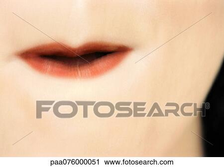 Stock Image - Close up of woman's mouth.. Fotosearch