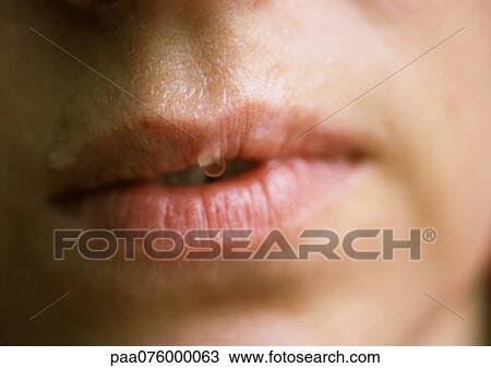 Stock Image - Close up of woman's mouth.. Fotosearch