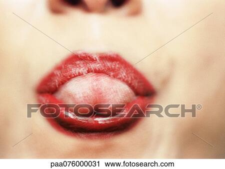Close up of woman's mouth with tongue sticking out, blurry. View Large Photo Image Stock Image - Close up of woman's mouth with tongue sticking out, blurry.. Fotosearch