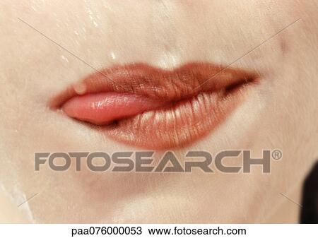 Close Up Of Woman S Mouth With Tongue Sticking Out The Side Stock Image Paa Fotosearch