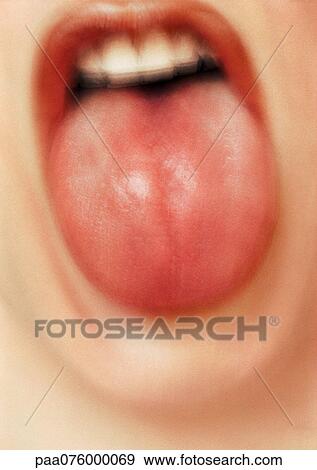 Stock Photo - Close up of woman's mouth with tongue sticking out, blurry.. Fotosearch