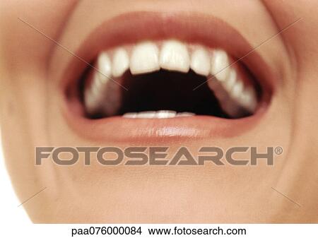 Picture - Close up of woman's open mouth smiling.. Fotosearch