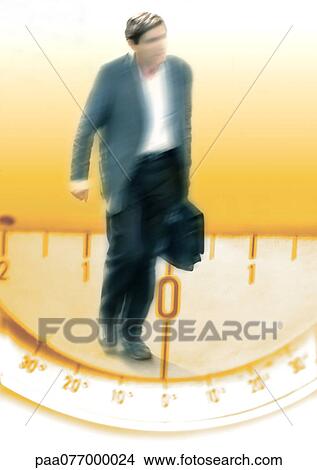 Picture - Businessman walking on protractor, montage. Fotosearch