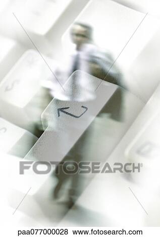 Stock Photo - Businessman walking through computer keyboard, montage. Fotosearch