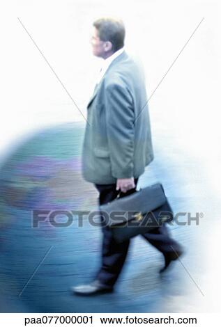 Stock Image - Businessman walking with briefcase on globe, montage. Fotosearch