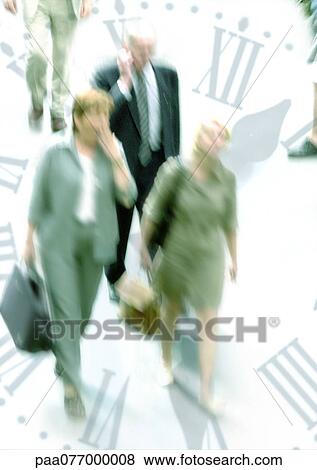 Stock Photo - Businesspeople walking through clock, montage. Fotosearch
