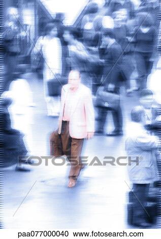 Stock Image - Man, in color, walking through crowd in b&w. Fotosearch
