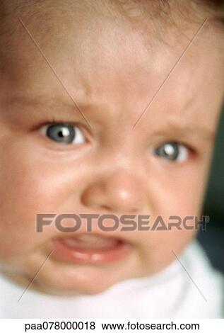 Baby crying, close-up, blurred View Large Photo Image Stock Photo - Baby crying, close-up, blurred. Fotosearch