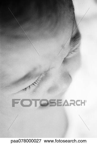 Stock Photo - Baby crying, close-up, high angle view, B&W.. Fotosearch
