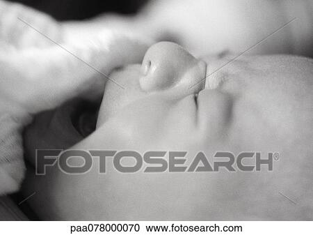 Baby crying, partially covered with blanket, close-up, B&W. View Large Photo Image Stock Image - Baby crying, partially covered with blanket, close-up, B&W.. Fotosearch