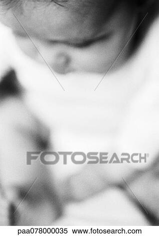 Stock Photography - Baby, head down, view from above, close-up, B&W.. Fotosearch