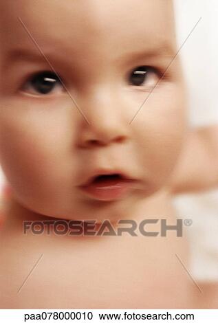 Baby looking at camera, close-up, blurred View Large Photo Image Stock Image - Baby looking at camera, close-up, blurred. Fotosearch