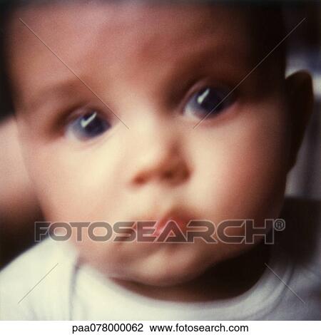 Baby looking at camera, close-up, blurred. View Large Photo Image Stock Image - Baby looking at camera, close-up, blurred.. Fotosearch