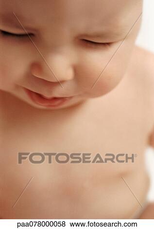 Baby looking down, close-up. View Large Photo Image Stock Photo - Baby looking down, close-up.. Fotosearch