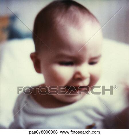 Baby looking down, mouth open, close-up, blurred. View Large Photo Image Stock Photo - Baby looking down, mouth open, close-up, blurred.. Fotosearch