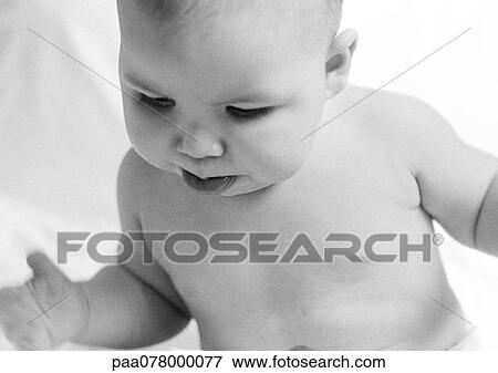 Baby looking down, sticking out lower lip, B&W. View Large Photo Image Stock Photo - Baby looking down, sticking out lower lip, B&W.. Fotosearch