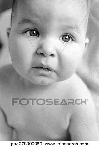 Stock Photo - Baby looking up, close-up, B&W.. Fotosearch