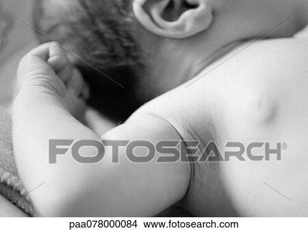 Picture - Baby's chest and arm, close-up, B&W.. Fotosearch