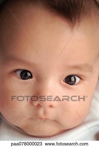 Stock Image - Baby's face, close-up.. Fotosearch