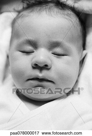 Stock Photo - Baby's head, eyes closed, B&W.. Fotosearch