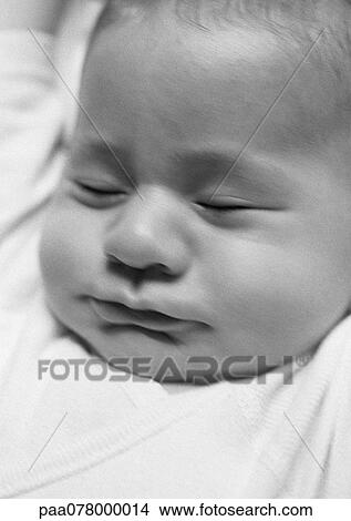 Picture - Baby's head with eyes closed, B&W.. Fotosearch