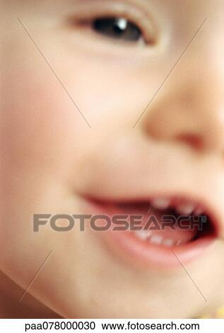 Partial view of baby's face, mouth open, close-up, blurred View Large Photo Image Stock Image - Partial view of baby's face, mouth open, close-up, blurred. Fotosearch