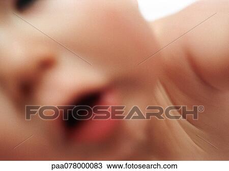 Partial view of baby's face, mouth open, blurred. View Large Photo Image Stock Image - Partial view of baby's face, mouth open, blurred.. Fotosearch