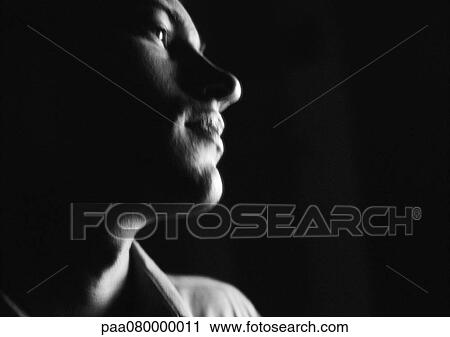 Man tilting head back, close-up, side view, black and white. View Large Photo Image Stock Image - Man tilting head back, close-up, side view, black and white.. Fotosearch