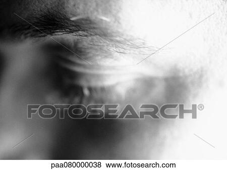 Stock Photo - Man's eye, blurred, close-up, b&w. Fotosearch
