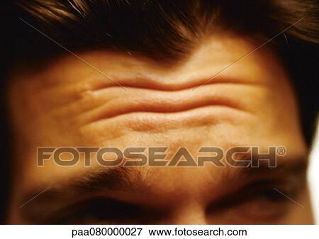 Man's furrowed brow, extreme close-up View Large Photo Image Stock Photo - Man's furrowed brow, extreme close-up. Fotosearch