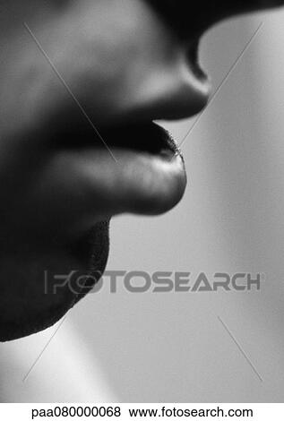 Stock Photo - Man's lips, side view, close-up, black and white.. Fotosearch