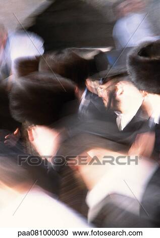 Stock Image - Israel, Jerusalem, Jewish men, blurred. Fotosearch