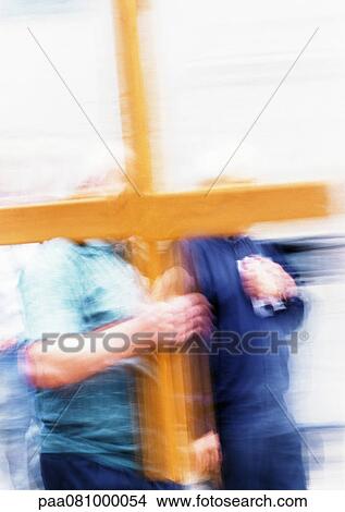 Picture - Israel, Jerusalem, man carrying cross, blurred. Fotosearch