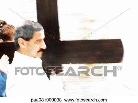 Stock Photo - Israel, Jerusalem, man carrying cross.. Fotosearch