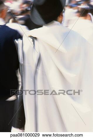 Stock Photo - Israel, Jerusalem, man in crowd, rear view. Fotosearch